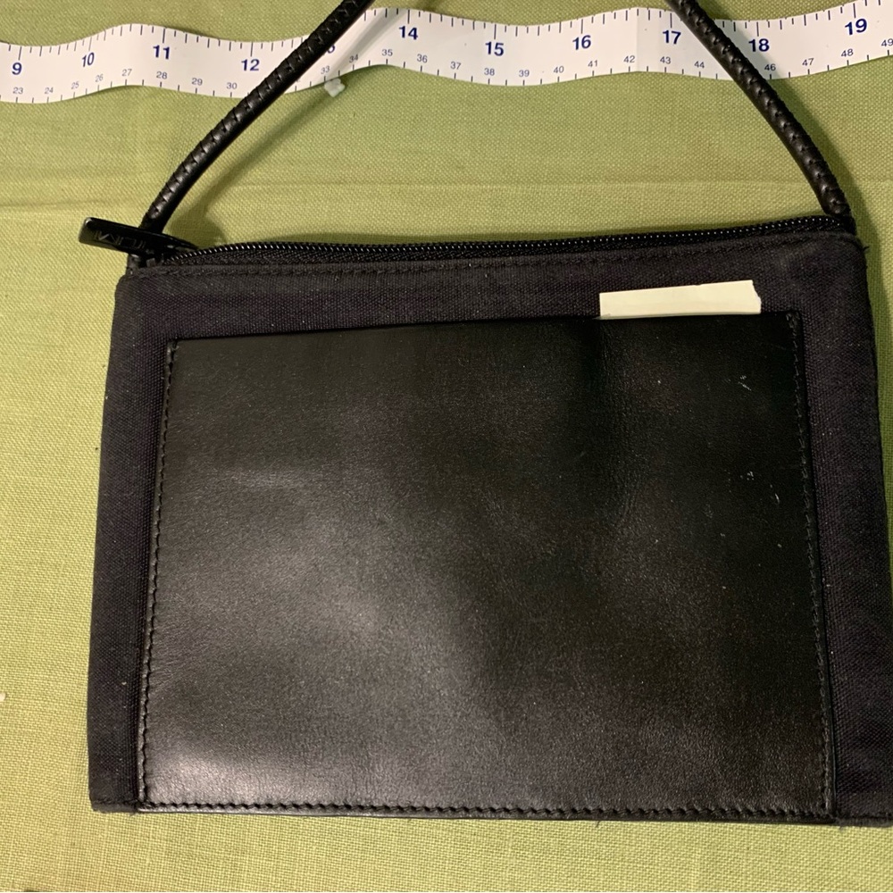 Tumi small crossbody  8x6 front leather Velcro pockets